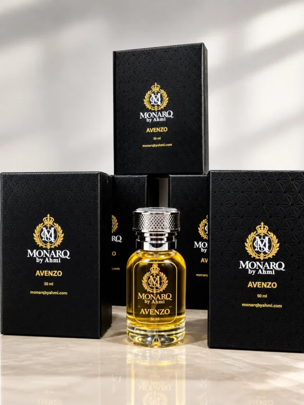 Monarq Avenzo 50ml perfume bottle in front of black Monarq gift boxes