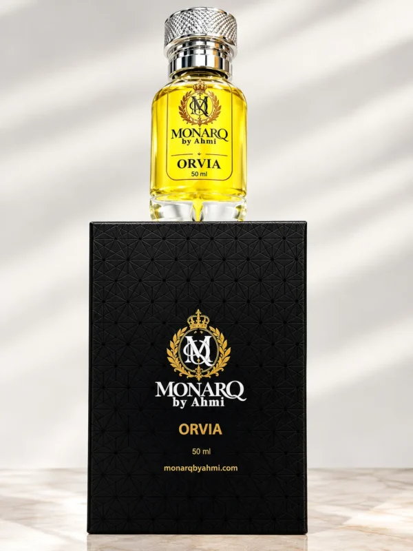 Monarq Orvia 50ml yellow perfume bottle standing on its black gift box