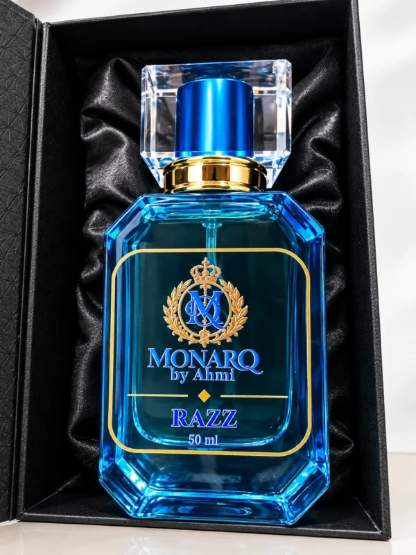 Monarq Razz 50ml blue perfume bottle in a black satin-lined gift box